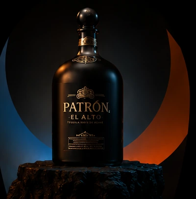 Patrón El Alto bottle photographed against a lit backdrop